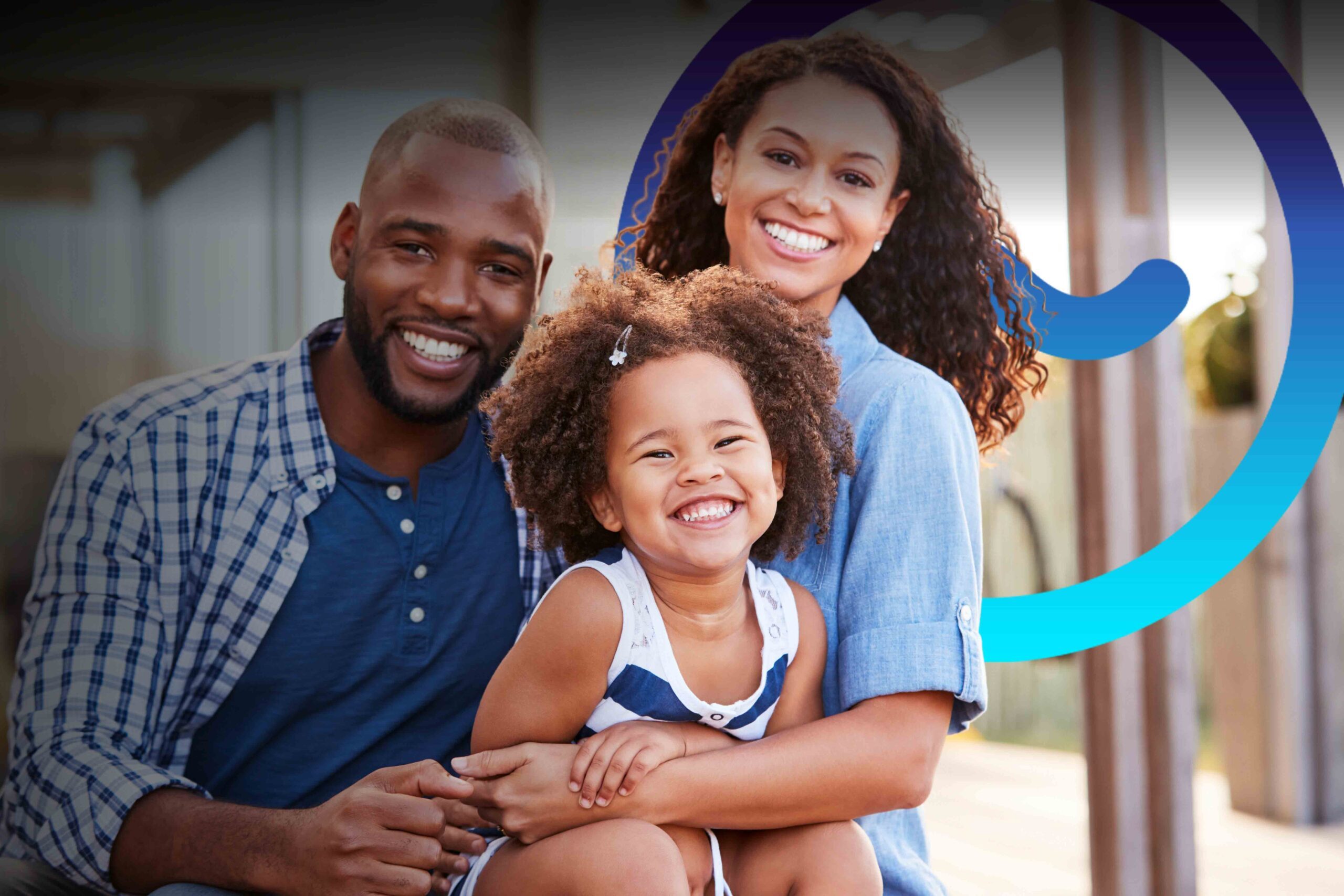 Cheerful african mother and indian father playing with son at home. Cute boy enjoying sitting on father shoulder while looking at camera. Middle eastern family having fun together on the sofa at home.